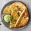 plate of vegan black bean tacos with cilantro lime sauce
