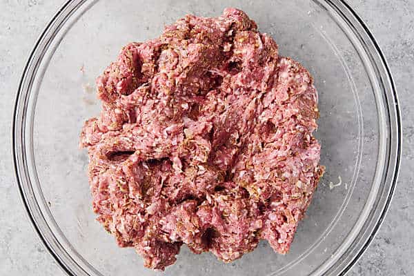 adding in ground beef and pork