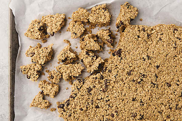 breaking oatmeal granola slab into clusters