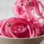 quick pickled red onions on a fork