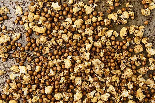 roasted cauliflower and chickpeas on a sheet pan