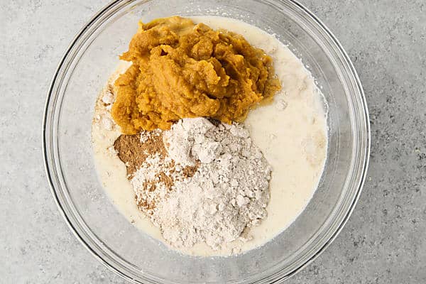 ingredients in a bowl to make pumpkin muffins