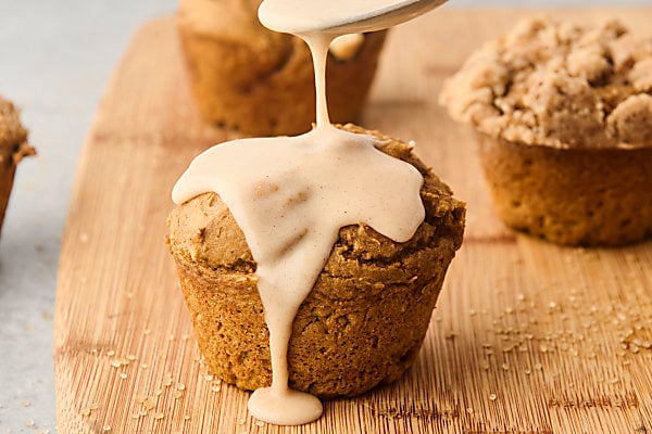 drizzling pumpkin muffins with glaze