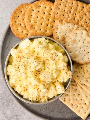 bowl of cottage cheese egg salad with crackers