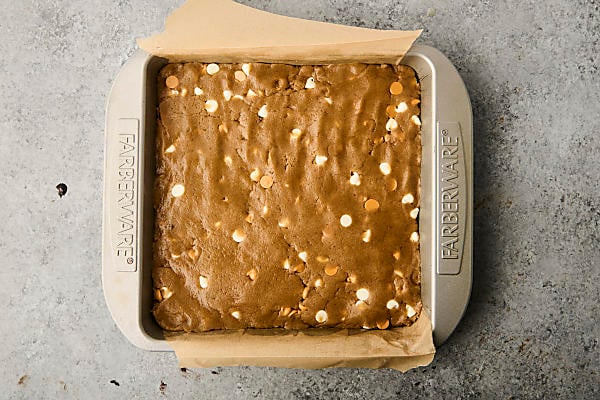 pressing batter into a 9x9 inch baking dish