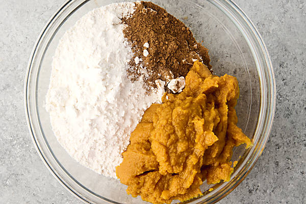 cake mix pumpkin cookie ingredients in a bowl