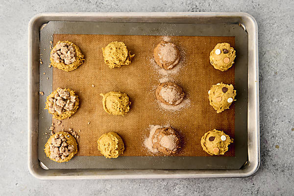 cookie dough scooped onto a prepared baking sheet